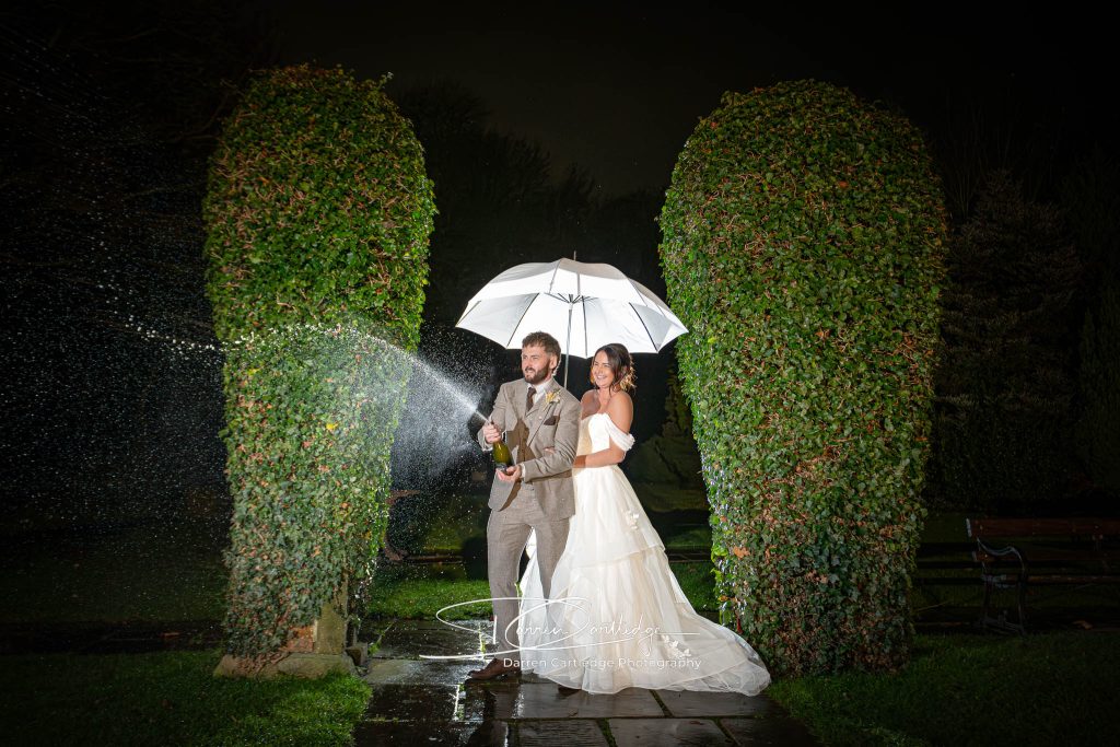 Bride and Groom celebrate with champagne, captured by a South Yorkshire Wedding Photographer.