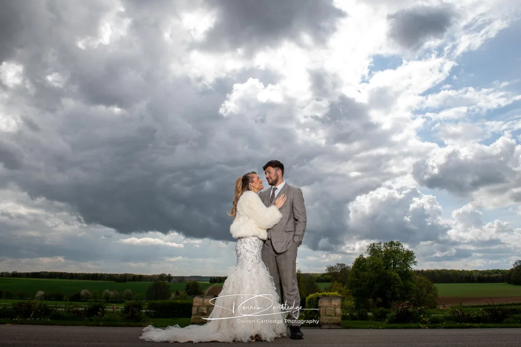 Yorkshire Wedding Photographer - Bride and Groom Embrace at Hazelwood Castle.