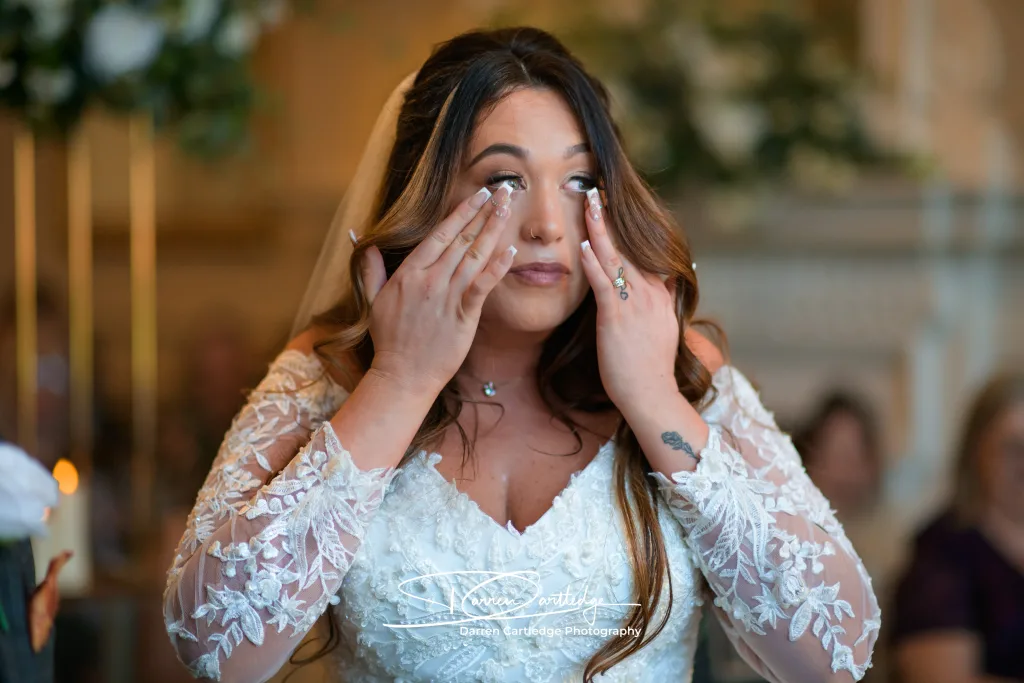Leeann taking a quiet moment during her wedding ceremony at Bawtry Hall, South Yorkshire